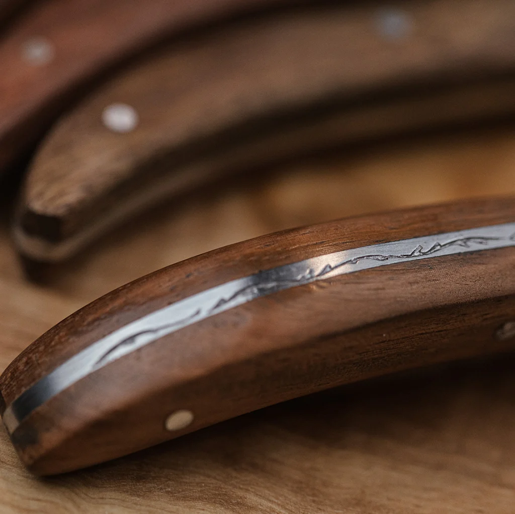 Close-up of the rosewood handle of a Laguiole Du Monde Exclusive fork